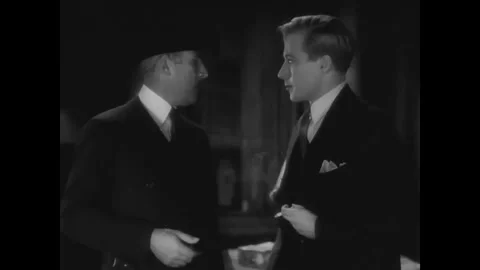 US - 1930 - in this drama, an inspector finds a body and accuses a couple. The Stock Footage 341003773