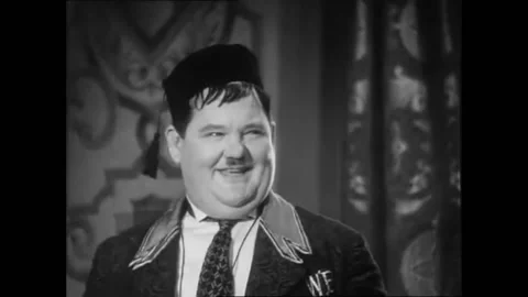 US - 1930 - in this Laurel and Hardy comedy, a woman asks a man, who is Stock Footage 323258718