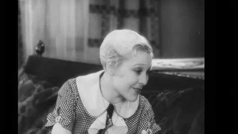 US - 1931 - in this comedy, two friends are catching up. One of them informs her Stock Footage 277342825