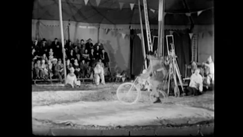 US - 1933 - A circus group performer feats for a crowd. Stock Footage 340585836