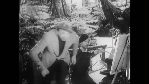 US - 1933 - in this comedy, a thief steals a painter's purse at a park. A clumsy Stock Footage 288085356