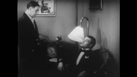 US - 1933 - in this comedy, when a man talks about his romantic exploits, his Stock Footage 254201359