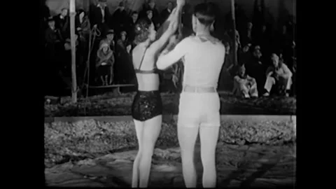 US - 1933 - A pair of acrobats perform at a circus. Stock Footage 340585834