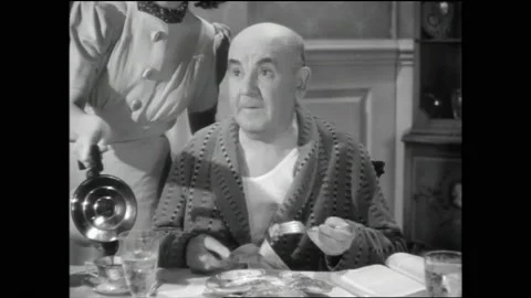 US - 1939 - in this comedy, during breakfast, a man tells his older brother Stock Footage 330606042