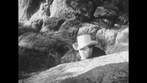 US - 1941 - in this western, when the leader of a criminal gang is injured in a Stock Footage 341342986