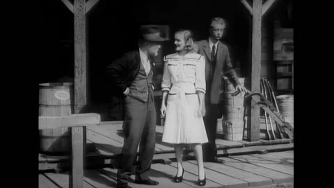 US - 1942 - in this comedy, an old man asks his near-sighted friend to give the Stock Footage 323263937