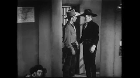 US - 1942 - in this western, a man posing as a corrupt investigator frees an Stock Footage 340591159