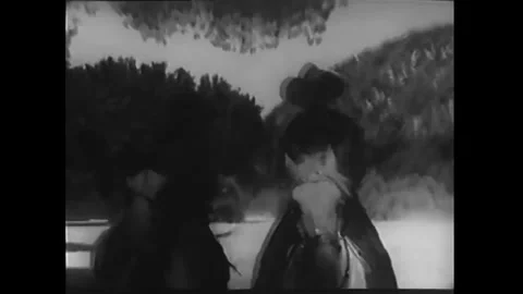 US - 1942 - in this western, a man posing as a corrupt investigator holds Stock Footage 340591160