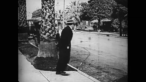 US - 1944 - in this silent comedy, a man tries to commit suicide by lying down Stock Footage 254195579
