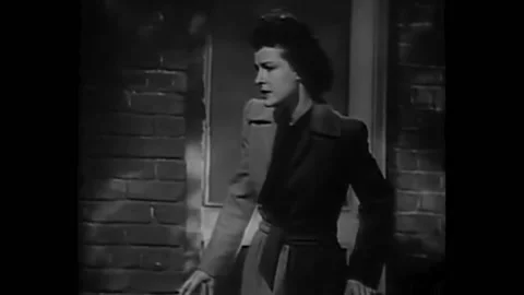 US - 1945 - in this comedy, a man carrying a duck hides in a cellar when a dog Stock Footage 323220096