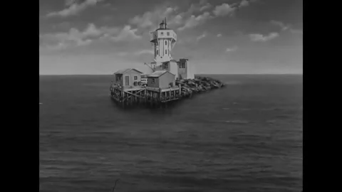 US - 1947 - in this drama, a lighthouse worker covers a fourth-order Fresnel Stock Footage 337956336