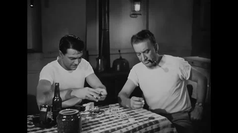 US - 1947 - in this drama, a lighthouse worker loses to his colleague in a poker Stock Footage 337956615