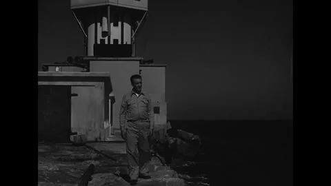 US - 1947 - in this drama, a lighthouse worker watches with anticipation as his Stock Footage 337957443