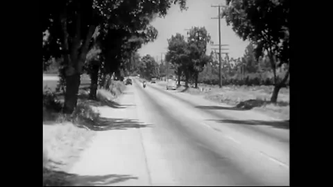 US - 1950 - in this drama, a motorcycle cop tries to stop an illegal hot rod Stock Footage 325207367