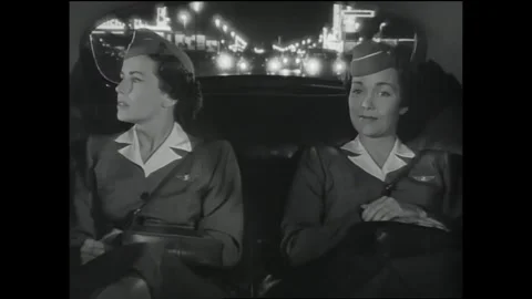 US - 1951 - in this comedy, flight attendants ride in a taxi at night, excited Stock Footage 341323111
