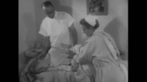US - 1956 - in this drama, a doctor performs various tests on a multiple Stock Footage 316636468