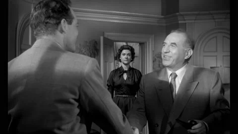 US - 1956 - in this drama, a manager introduces himself to a new colleague and Stock Footage 330602744