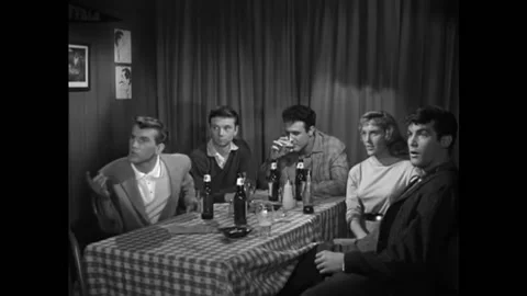 US - 1958 - in this comedy, men are blown away when a blond bombshell enters a 库存影片 323260915