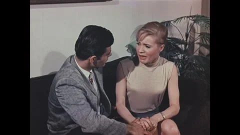 US - 1967 - in this drama, a devastated teacher cries in her boyfriend's arms 動画素材 341992382