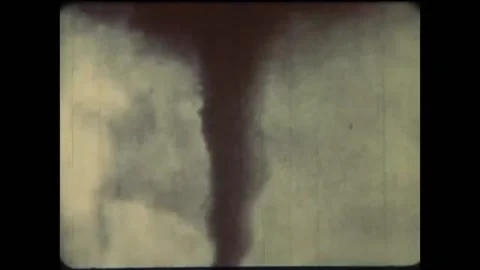 US - 1976 - in this documentary, a tornado rages toward a town. A siren warns Stock Footage 325215868