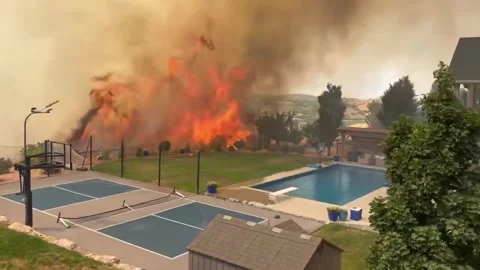 US: Adams Fire Races Toward Utah Homes As Flames Surge Through Dry Brush Stock Footage 340858562