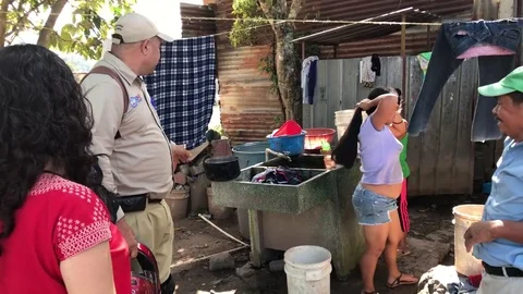 US Aid member visiting a poor home in Guatemala Stock Footage 84872797