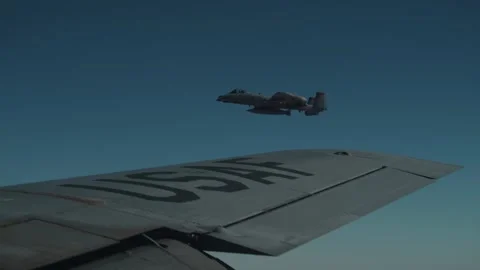 U.S. Air Force A-10 Thunderbolt flying on the wing of KC-135 Stratotanker Stock Footage 297664389