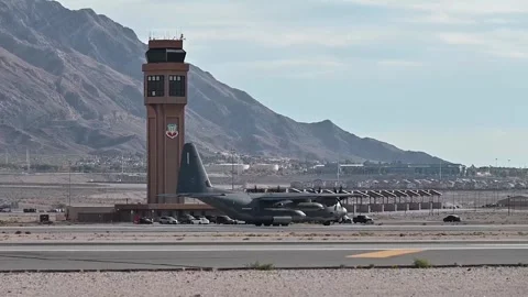 U.S. Air Force AC-130 Gunship taxiing by control tower at Nellis Air Force Base Stock Footage 258229342
