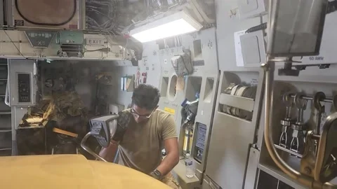 U.S. Air Force airman directing vehicle into rear of cargo aircraft Stock Footage 213922939