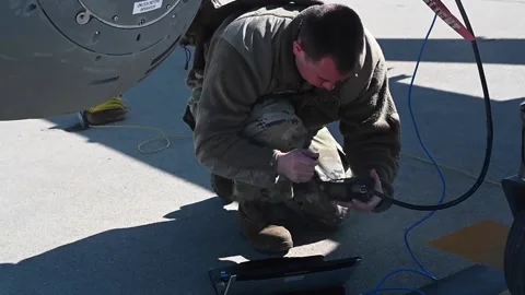 U.S. Air Force airman operating computer to programme MQ-9 Reaper Stock-Footage 239637832
