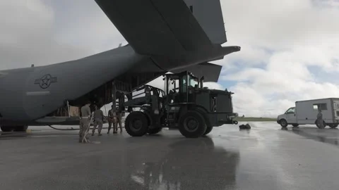 U.S. Air Force Airmen loading air-drop bundles onto C-130 Hercules aircraft Stock-Footage 257770111