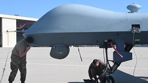 U.S. Air Force airmen programming MQ-9 Reaper using laptop computer Stock Footage 239637829