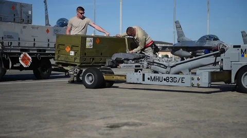 U.S. Air Force ammo box being secured on bomb loader during training program Stock Footage 83309315