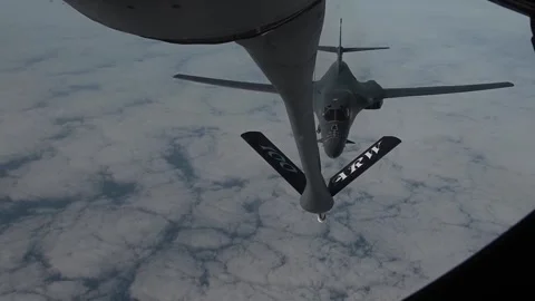 U.S. Air Force B-1B Lancer approaching KC-135 boom for aerial refueling Stock Footage 264024665