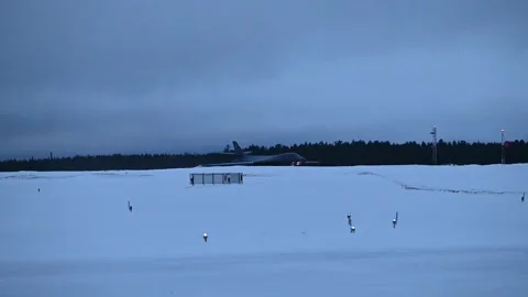 U.S. Air force B-1B Lancer aircraft touching down in snow covered landscape Stock Footage 265857375