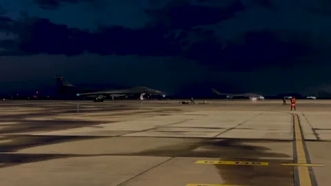 U.S. Air Force B-1B Lancer aircraft taxiing at night Stock Footage 272588117