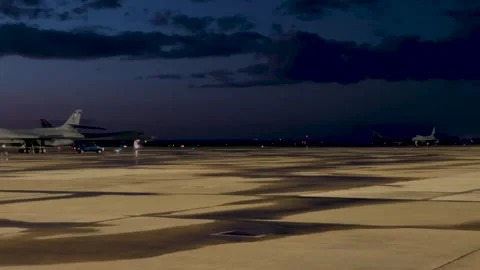 U.S. Air Force B-1B Lancer aircraft taxiing at dusk Stock Footage 272588121