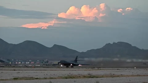 U.S. Air Force B-1B Lancer taking off with reheat at sunset from Nellis AFB Video stock 281932042