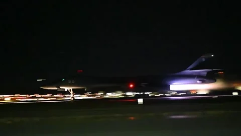 U.S. Air Force B-1B Lancer aircraft taking off at night with afterburner Video stock 292972310