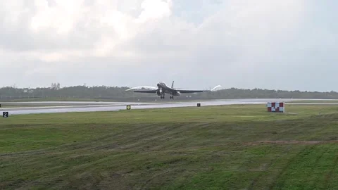 U.S. Air Force B-1B Lancer landing with vapor trails at Andersen Air Base, Guam Stock Footage 300260972
