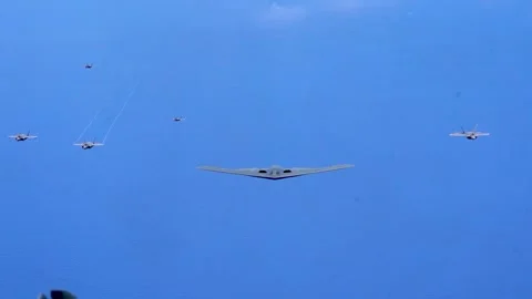 U.S. Air Force B-2 Spirit flying with F-35 Lightning and F-22 Raptor aircraft Video stock 277571573