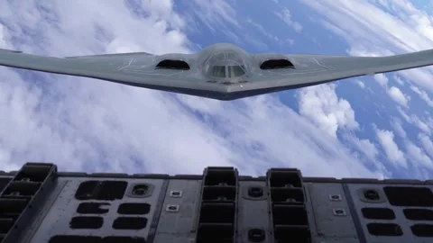 U.S. Air Force B-2 Spirit aircraft flying above clouds Stock Footage 277571595