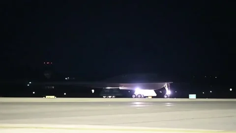 U.S. Air Force B-2 Spirit Bomber Task Force aircraft taxiing at night Stock Footage 282170684