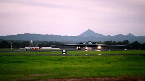 U.S. Air Force B-2 Spirit stealth bomber taxiing for take-off at dusk Stock Footage 284217868