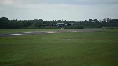 U.S. Air Force B-52 Stratofortress aircraft deploys drogue parachute on landing Stock Footage 276414908