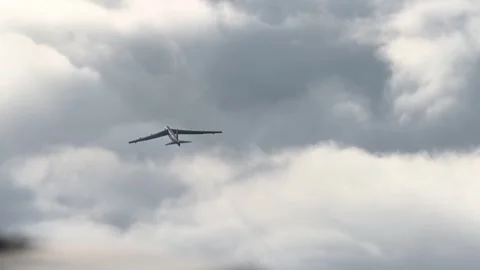 A U.S. Air Force B-52 Stratofortress flying above clouds during bomber mission Stock Footage 294522768