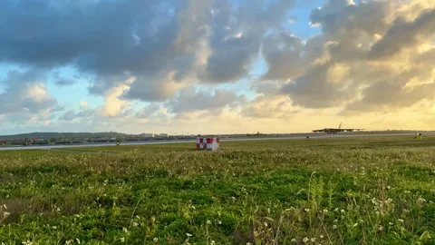 U.S. Air Force B-52H Stratofortress aircraft landing at sunset Stock Footage 264577837