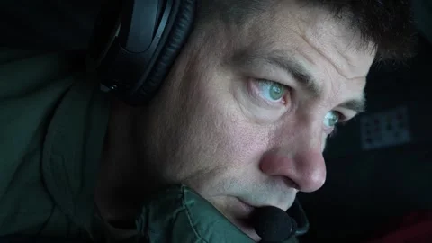 U.S. Air Force boom operator in boom pod with chin resting on chin rest Stock Footage 256972114