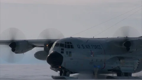 U.S. Air Force C-130 Hercules fitted with skids taxiing over snow in Greenland Stock Footage 106866068