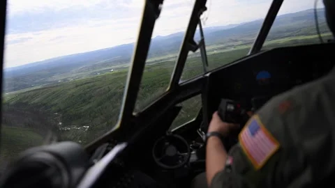 U.S. Air force C-130 Hercules pilot flying at low level over Alaska Stock Footage 277400996